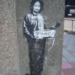 banksy-painted-charles-manson-as-a-hitchhiker-on-a-london-street-corner-in-2005-8×6.jpg