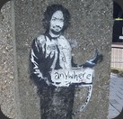 banksy-painted-charles-manson-as-a-hitchhiker-on-a-london-street-corner-in-2005